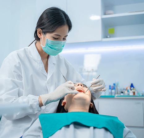 Dentist checking patient's gums